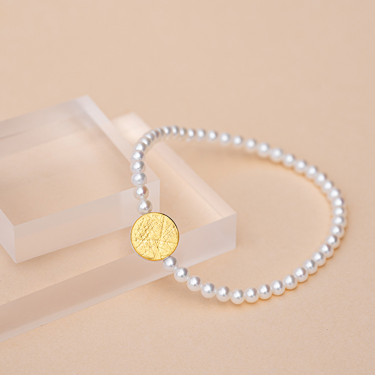 Perlenarmband mit Punkt Element aus Silber mit Gold mit aufgewalzter Struktur